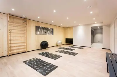 a yoga room with mats on the floor at La Cordee 412 Apartment - Chamonix All Year in Chamonix-Mont-Blanc