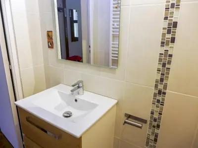 a bathroom with a toilet and a sink and a shower at Apartment Maison Novel by Interhome in Chamonix-Mont-Blanc