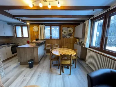 a living room with a couch and a table at Apartment Maison Novel by Interhome in Chamonix-Mont-Blanc