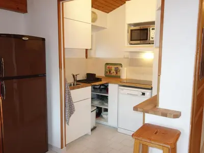 a bedroom with a large bed in a room at Apartment Martagon-1 by Interhome in Saint-Gervais-les-Bains
