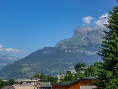 a mountain in the distance with houses and trees at Apartment Martagon-1 by Interhome in Saint-Gervais-les-Bains