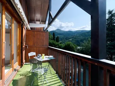 a kitchen and dining room with a table and chairs at Apartment Martagon-1 by Interhome in Saint-Gervais-les-Bains