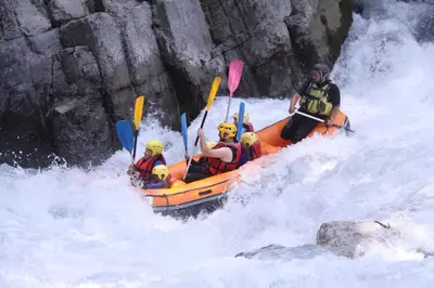 a group of people in a raft in the water at ECRINS ETOILE C9 in Samoëns