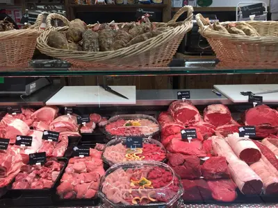 a display case in a store with meat and other foods at ECRINS ETOILE C9 in Samoëns