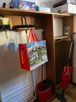 a room with a shelf with a broom and a bag at Grangettes in Les Carroz d'Araches