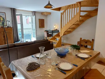 a bedroom with a bed and a table and a window at Apartment Conseil 1 by Interhome in Saint-Gervais-les-Bains