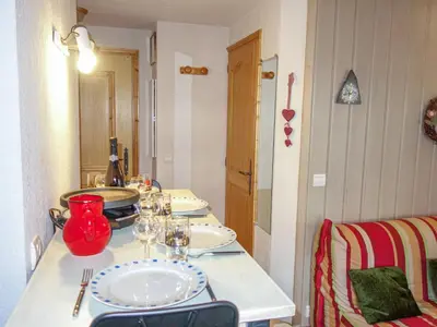 a living room with a couch and a table at Apartment Jardins Alpins 1 by Interhome in Saint-Gervais-les-Bains