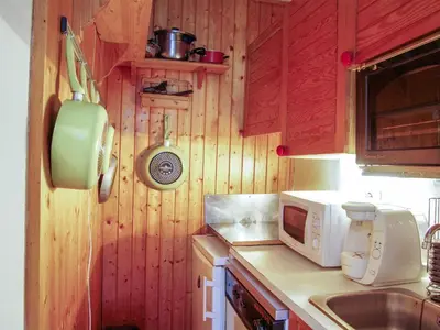 two bunk beds in a room with a door at Apartment Le Carlton-5 by Interhome in Chamonix-Mont-Blanc