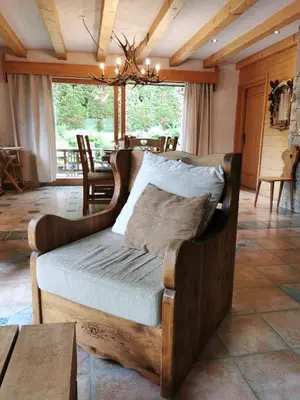 a bedroom with a bed in a room with a table at Thendia Montblanc in Les Houches