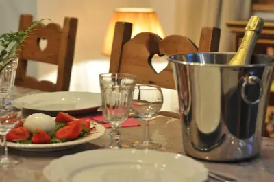 a table with a plate of food and a blender at Thendia Montblanc in Les Houches