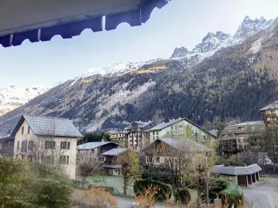 a group of buildings in front of a mountain at Apartment Le Krystor by Interhome in Chamonix-Mont-Blanc