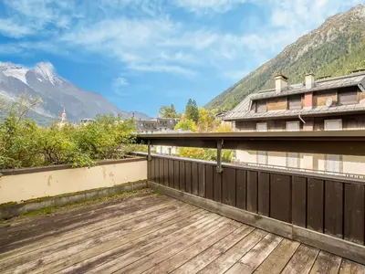 a building with cars parked in front of it at Apartment Le Mummery-4 by Interhome in Chamonix-Mont-Blanc