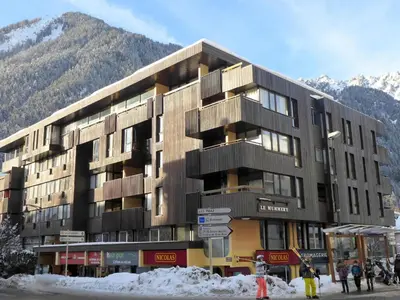a view from a balcony of a town with mountains at Apartment Le Mummery-4 by Interhome in Chamonix-Mont-Blanc
