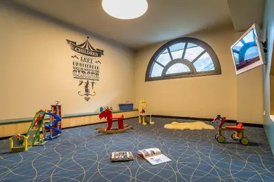 a room with childrens play equipment in a room at La Cordée - Charmant Appartement – 4 personnes in Chamonix-Mont-Blanc