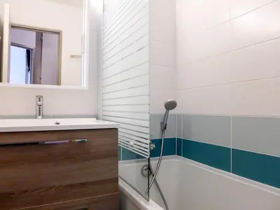 a bathroom with a sink and a bath tub at Apartment Jonquilles-7 by Interhome in Chamonix-Mont-Blanc