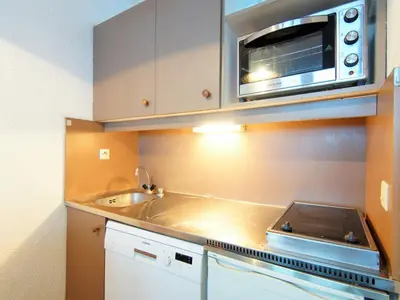 a kitchen with a sink and a microwave at Apartment Le Grépon-1 by Interhome in Chamonix-Mont-Blanc
