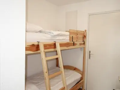 a white bathroom with a sink and a toilet at Apartment L'Enclave I et J-7 by Interhome in Les Contamines-Montjoie
