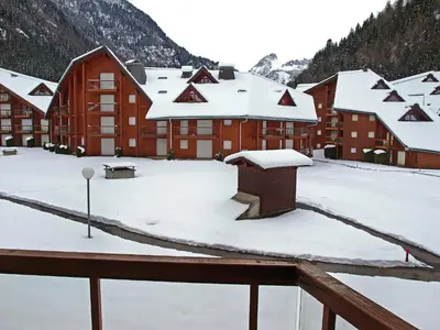 a large building with snow in front of it at Apartment L'Enclave I et J-7 by Interhome in Les Contamines-Montjoie