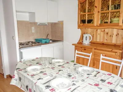a dining room with a table and chairs at Apartment L'Enclave I et J-7 by Interhome in Les Contamines-Montjoie