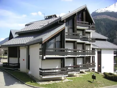 a large building with snow in front of it at Apartment Le Brûlaz by Interhome in Les Contamines-Montjoie