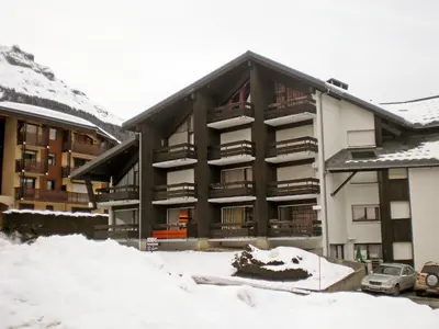an apartment building with balconies on the side of it at Apartment Le Brûlaz by Interhome in Les Contamines-Montjoie