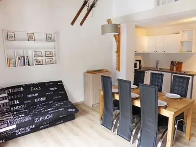a kitchen and dining room with a table and chairs at Apartment La Borgia A- B- C-10 by Interhome in Les Contamines-Montjoie