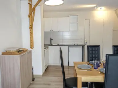 a kitchen and dining room with a table and chairs at Apartment La Borgia A- B- C-10 by Interhome in Les Contamines-Montjoie
