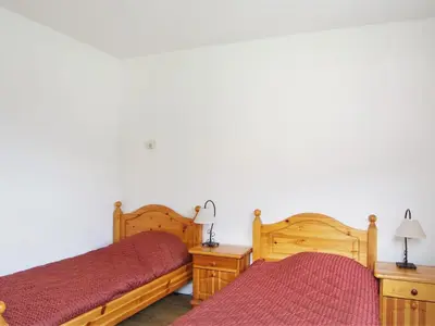 two beds sitting next to each other in a room at Apartment L'Hermine by Interhome in Les Houches