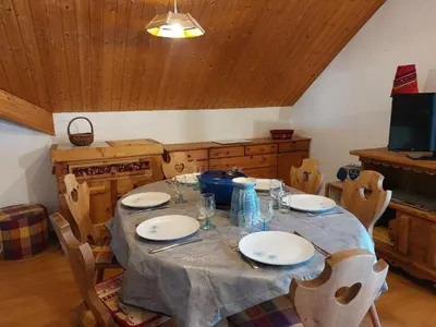 a kitchen with a table and chairs in a room at Apartment Les Combettes D et E by Interhome in Les Contamines-Montjoie