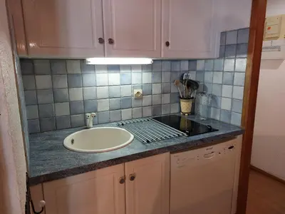 a bathroom with a sink and a counter top at Apartment Les Combettes D et E by Interhome in Les Contamines-Montjoie