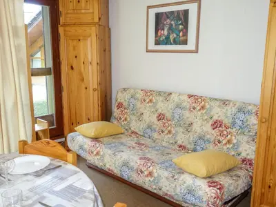 a dining room with a table and a bunk bed at Apartment La Borgia A- B- C-1 by Interhome in Les Contamines-Montjoie