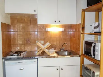 a small kitchen with a sink and a microwave at Apartment La Borgia A- B- C-1 by Interhome in Les Contamines-Montjoie
