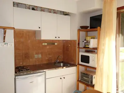 a bathroom with a white tub and a sink at Apartment La Borgia A- B- C-1 by Interhome in Les Contamines-Montjoie