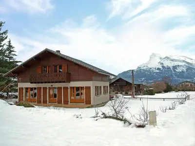 a patio with chairs and tables on a house at Chalet Chalet Mendiaux by Interhome in Saint-Gervais-les-Bains