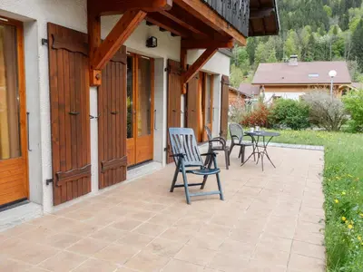 a bedroom with a bed in a wooden room at Chalet Chalet Mendiaux by Interhome in Saint-Gervais-les-Bains