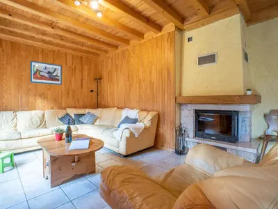 a living room with a couch and a fireplace at Chalet Chalet Mendiaux by Interhome in Saint-Gervais-les-Bains