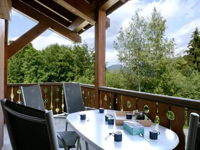 an apartment building with a wrap around balcony at Apartment Le Tagre by Interhome in Mémontel