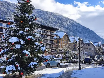 a christmas tree in a parking lot with snow on it at Apartment Le Tagre by Interhome in Mémontel