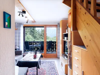 a bedroom with a large bed with a wooden ceiling at Apartment Le Tagre by Interhome in Mémontel