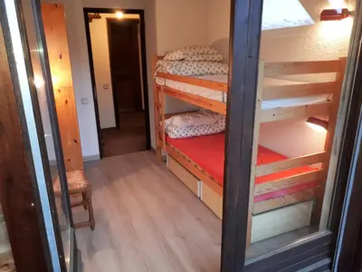 an empty room with two wooden stairs and a window at Saint Gervais - Le Bettex T3 Duplex (1400m d'altitude)/ 55m2 / Vue Mont Blanc - Aux Pieds des Pistes! in Saint-Gervais-les-Bains