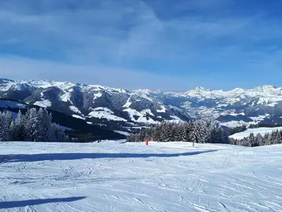 a snow covered slope with mountains in the background at Saint Gervais - Le Bettex T3 Duplex (1400m d'altitude)/ 55m2 / Vue Mont Blanc - Aux Pieds des Pistes! in Saint-Gervais-les-Bains