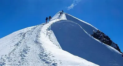 two people on top of a snow covered mountain at Saint Gervais - Le Bettex T3 Duplex (1400m d'altitude)/ 55m2 / Vue Mont Blanc - Aux Pieds des Pistes! in Saint-Gervais-les-Bains