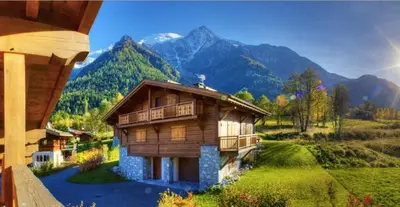 a model of a house with mountains in the background at CHALET CHAM'ROCK in Les Houches