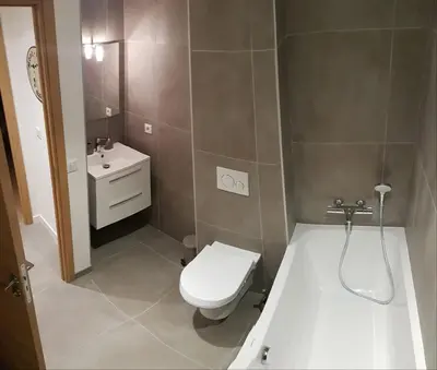 a small bathroom with a toilet and a sink at Résidence Luxe 5*,Spa & Fitness, La Cordée Appartement 214 in Chamonix-Mont-Blanc
