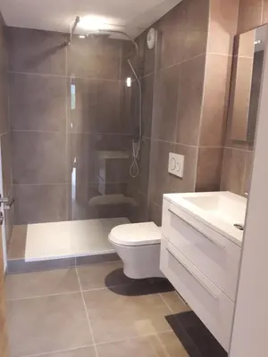 a bathroom with a shower and a toilet and a sink at Résidence Luxe 5*,Spa & Fitness, La Cordée Appartement 214 in Chamonix-Mont-Blanc