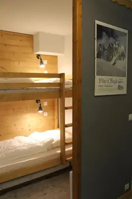 a couple of bunk beds in a room at L'Enclave in Les Contamines-Montjoie