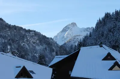 a view of the mountains with snow covered roofs at L'Enclave in Les Contamines-Montjoie