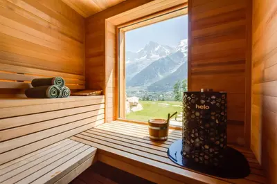 a sauna with a window with a mountain view at Le Chalet Mont Blanc in Les Houches