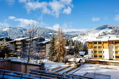 a resort in the mountains with snow on the ground at Wonderful 2 bedroms – Vacances Megeve – AW101 in Megève