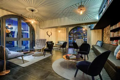 a living room with a couch and chairs at The Drus Luxury Apartment with Spa and Indoor Pool in Chamonix-Mont-Blanc
